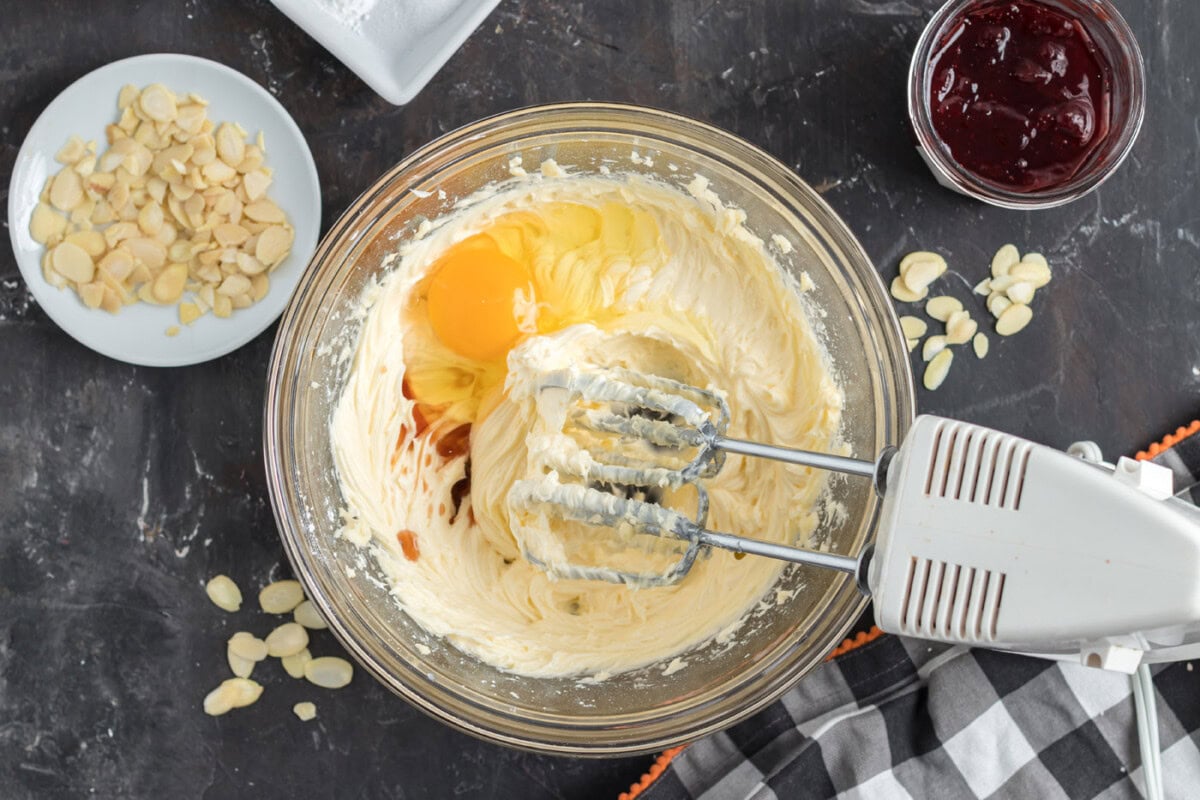 egg, vanilla, powdered sugar and butter mixed in a bowl