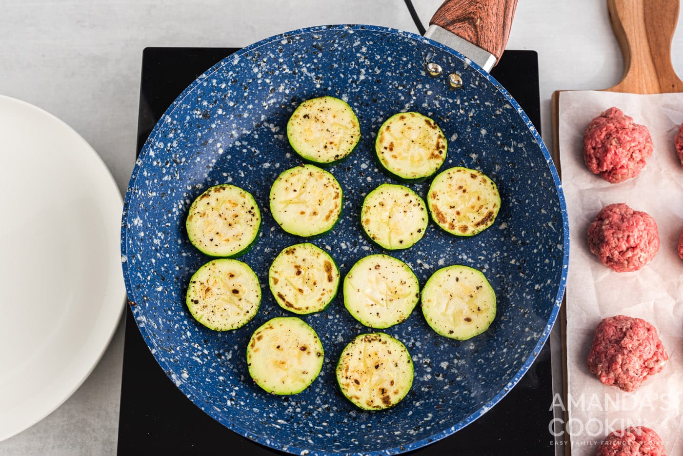 zucchini rounds browned in a skillet