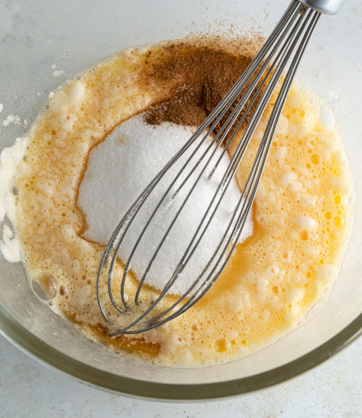 apple pancake batter with a whisk