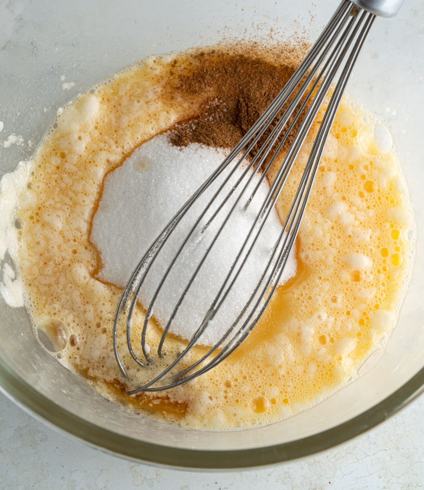 apple pancake batter with a whisk