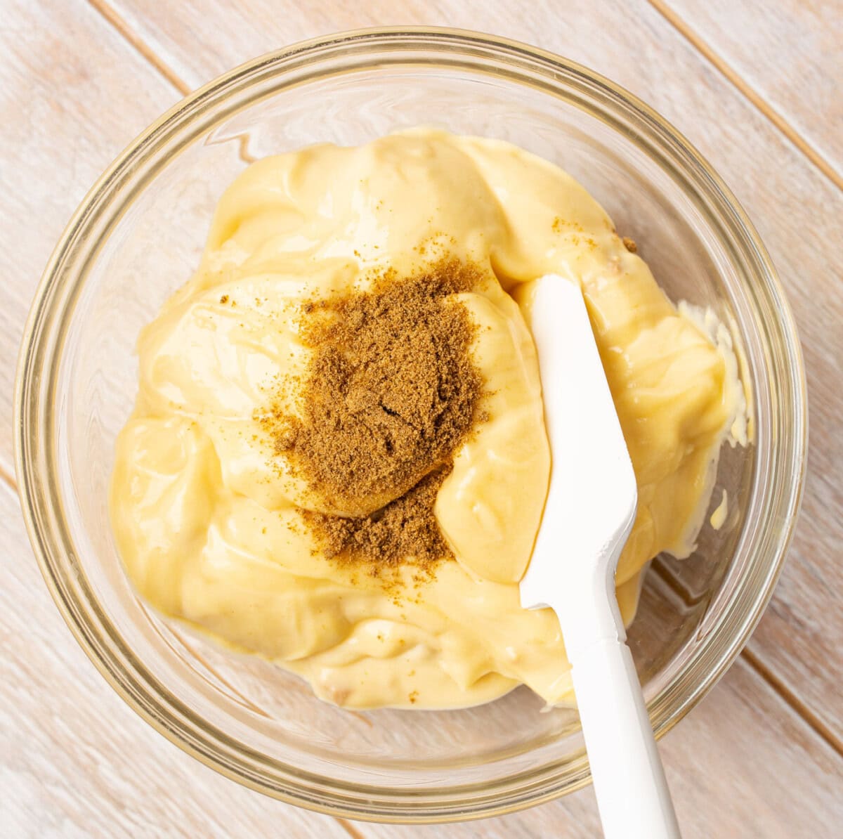 spatula mixing cream of chicken with cumin