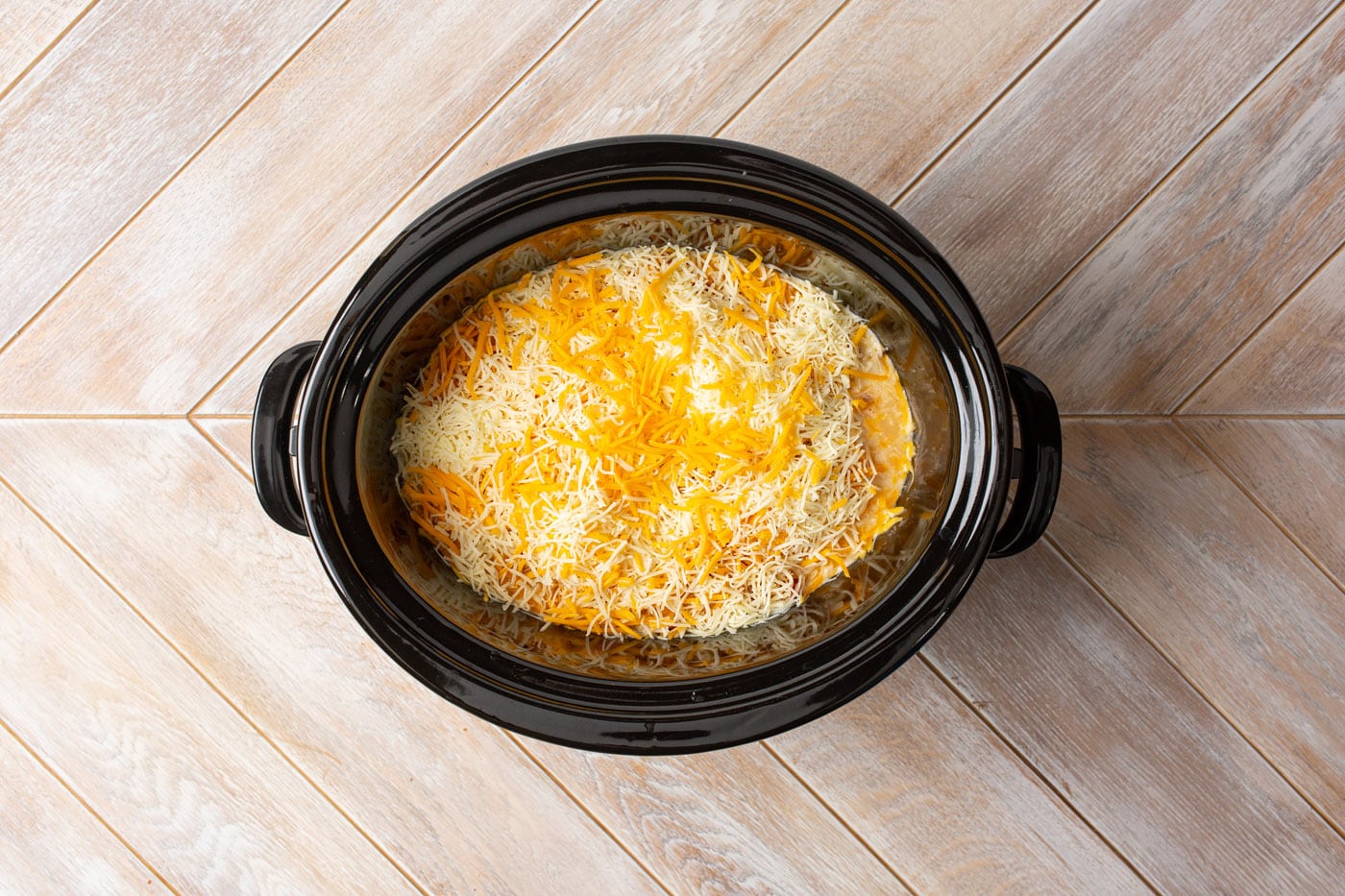 cheese on top of crockpot mexican chicken