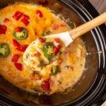 serving spoon of crockpot mexican chicken