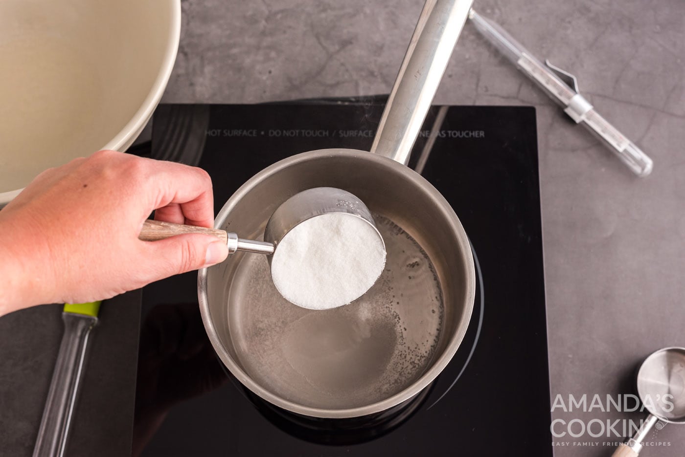 adding gelatin to cold water in a saucepan