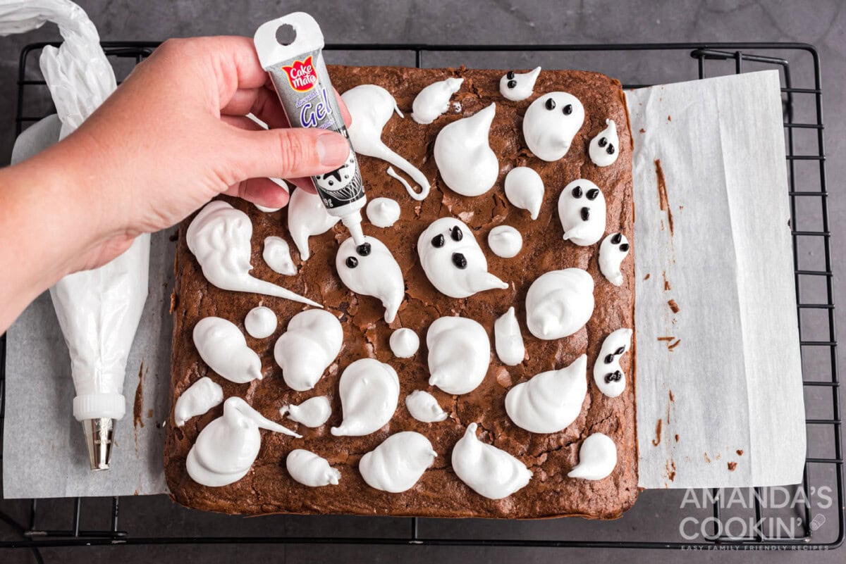 gel icing on marshmallow ghosts to make eyes and mouths