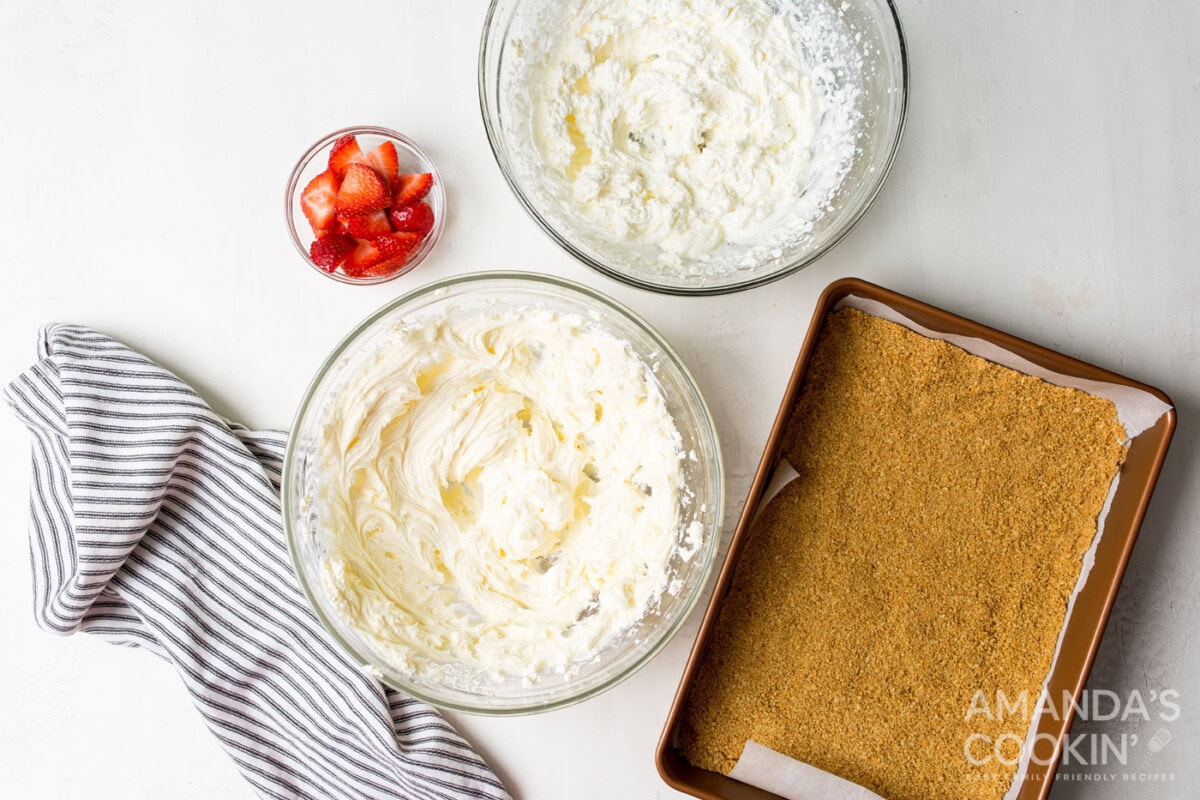 whipped cream and cheesecake mixture in bowls
