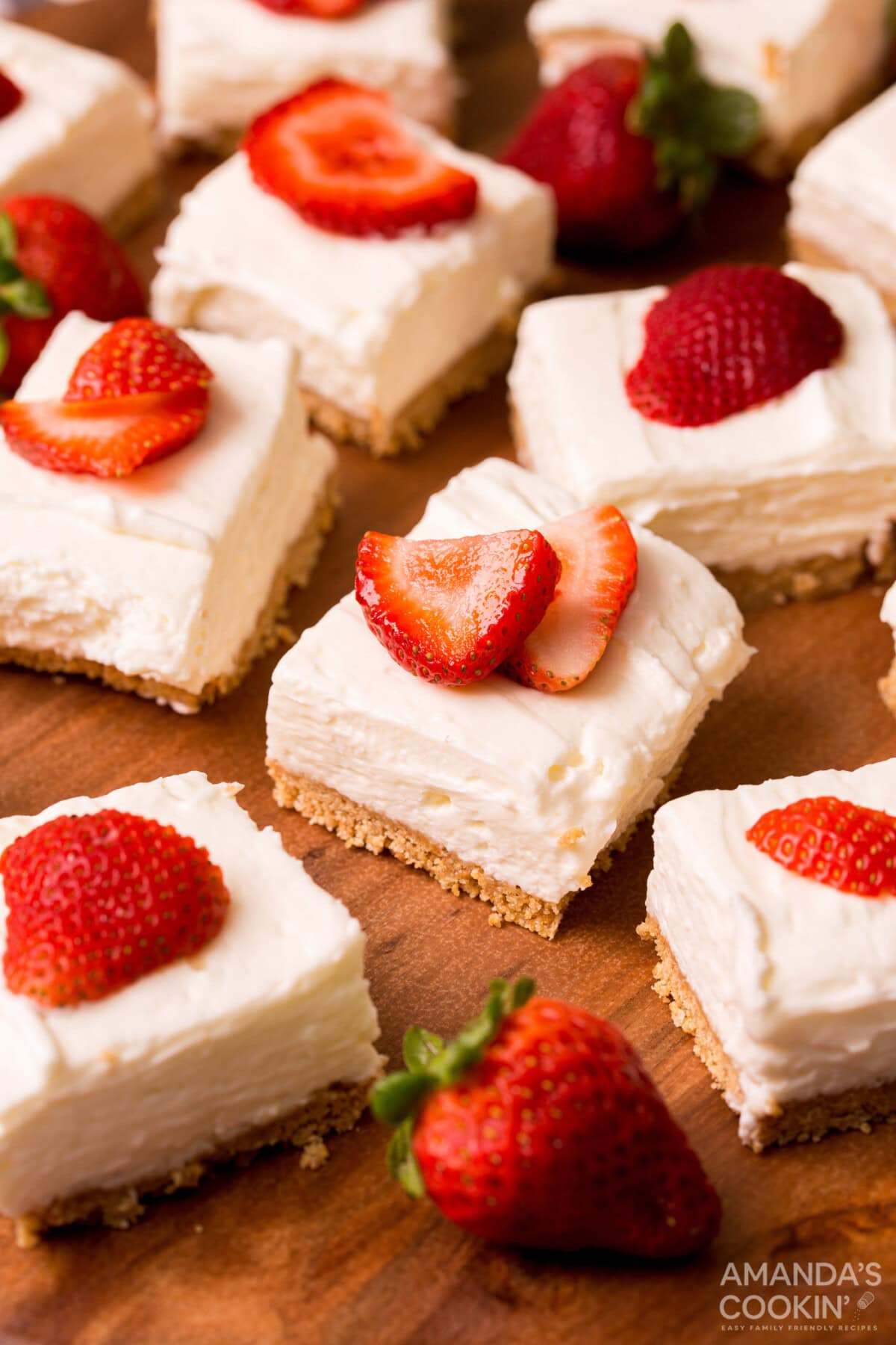 No Bake Cheesecake Bars with strawberry garnish