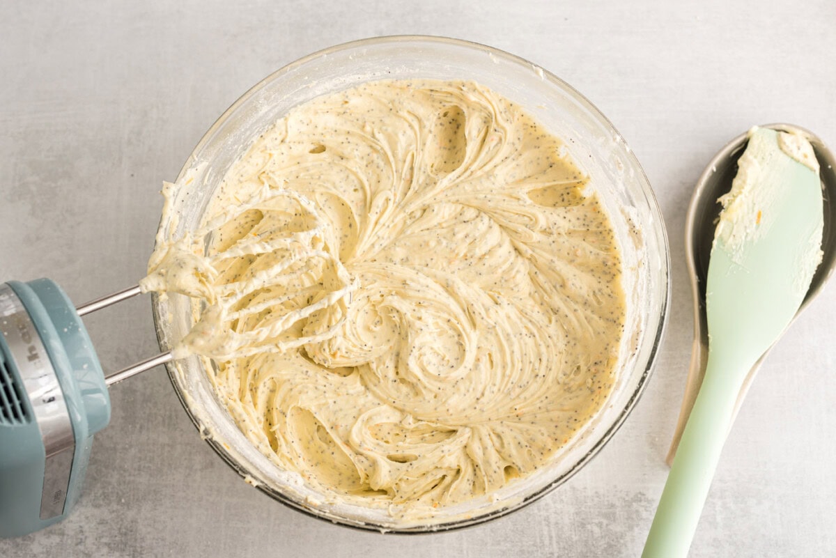 orange poppy seed pound cake batter in a bowl
