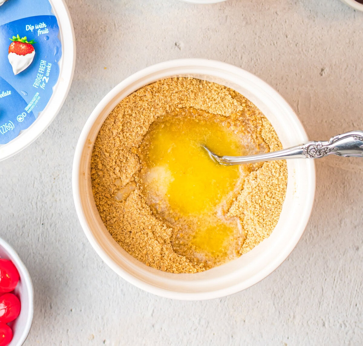 graham crackers and butter in a mixing bowl