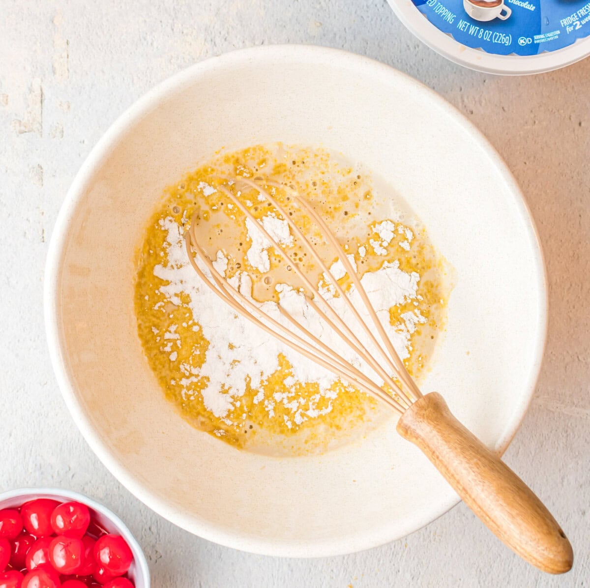 vanilla instant pudding mix added to root beer in a bowl