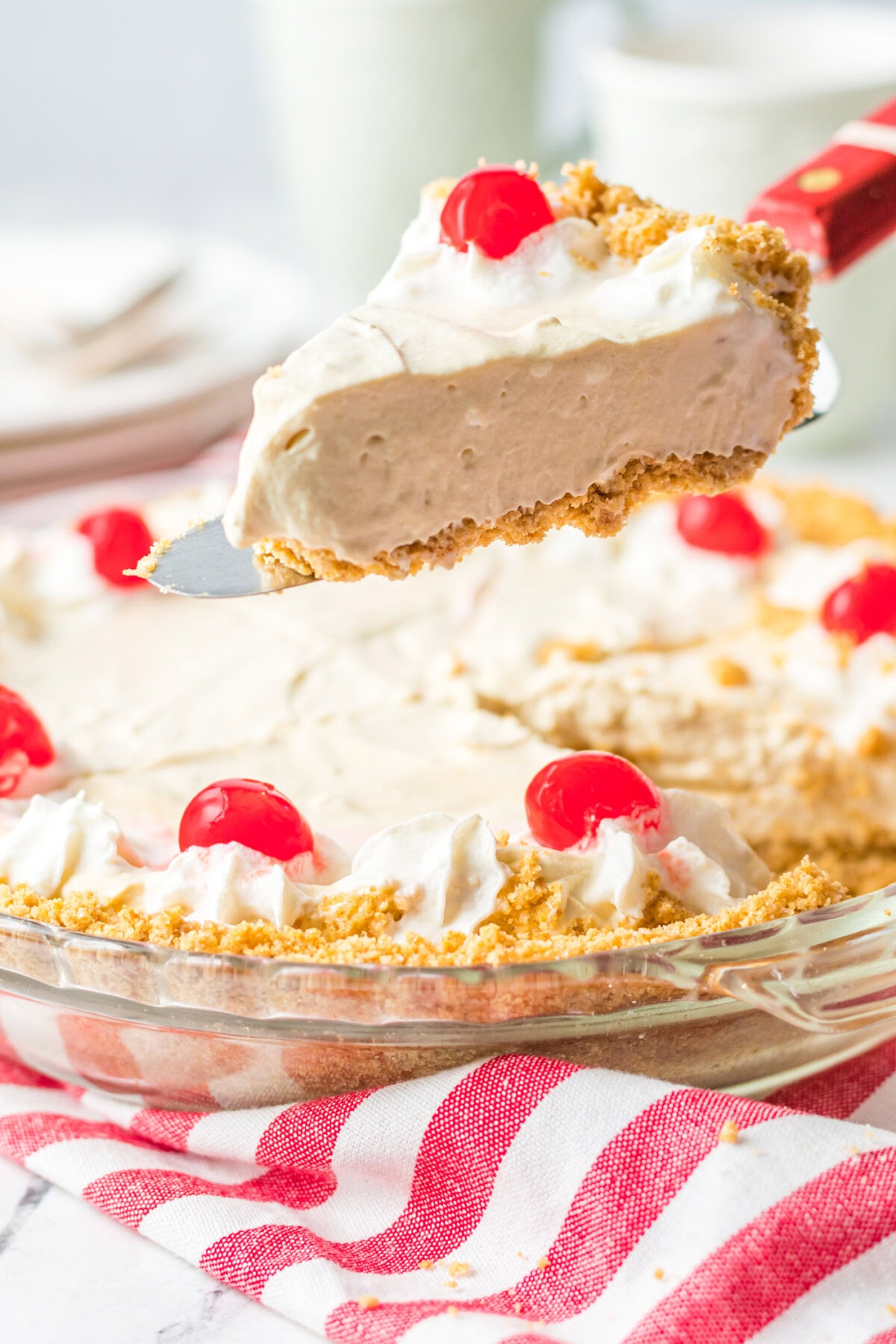 lifting a slice of Root Beer Float Pie