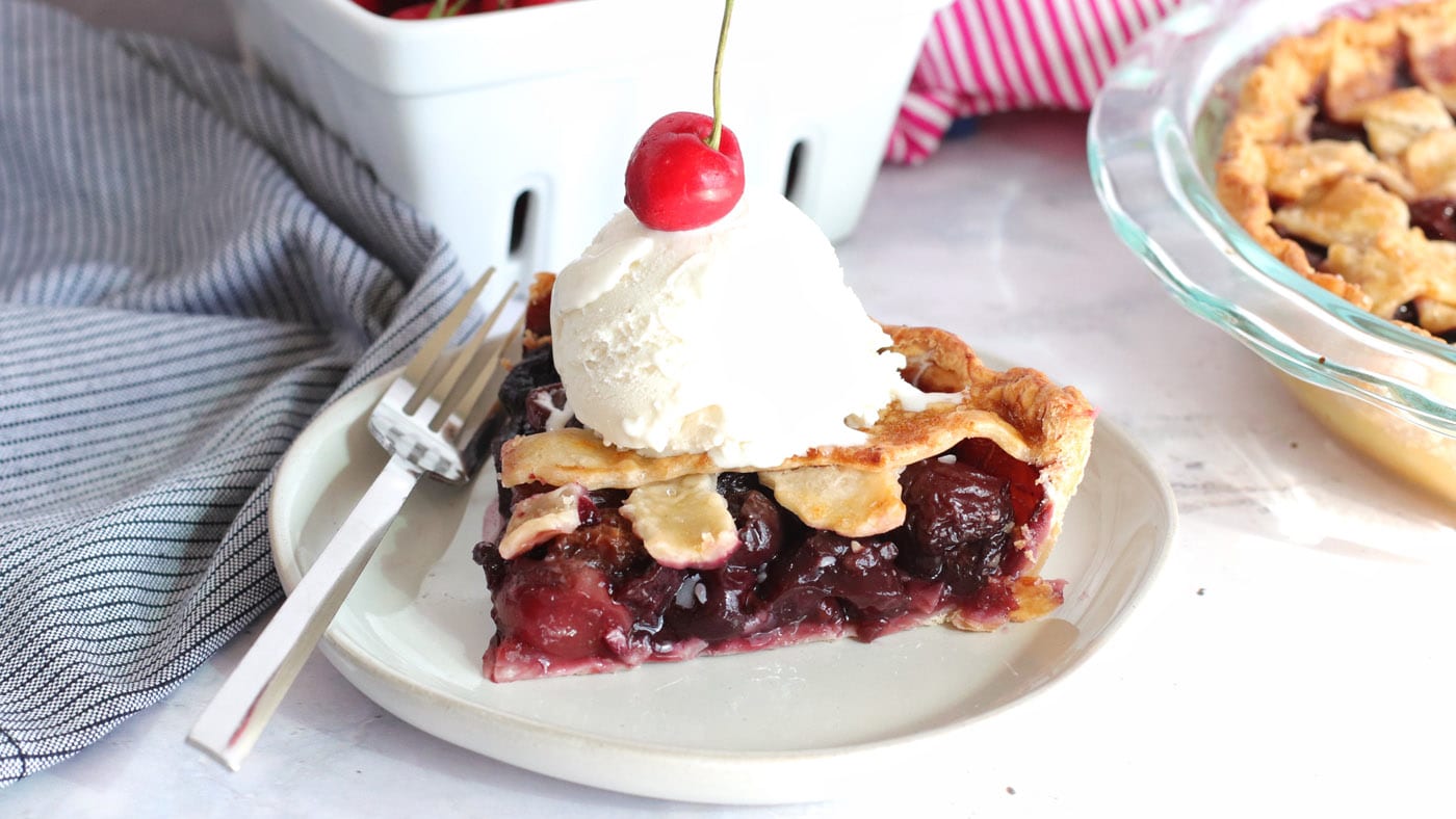 Cherry pie is quite timeless, especially when baked to a bubbly golden brown and topped with vanilla
