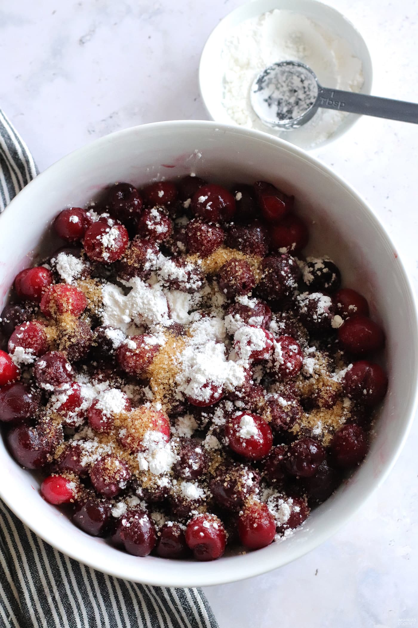cherries in a bowl of sugar
