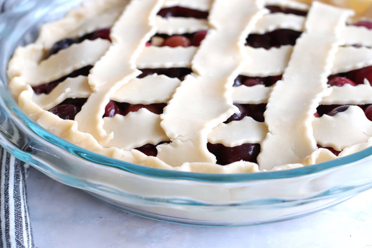 dough tucked into cherry pie