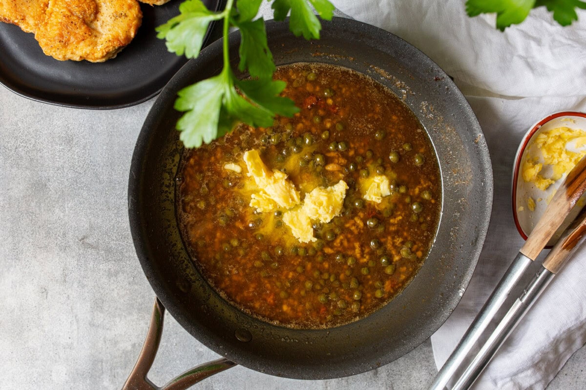 caper, lemon juice, and garlic in a skillet