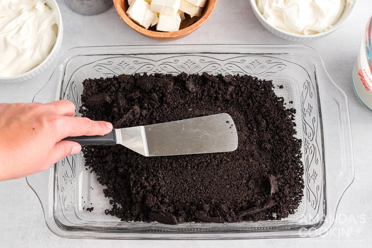 spatula patting down oreo crumbs