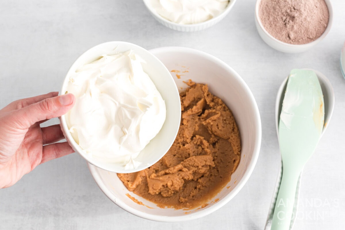 adding cool whip to peanut butter mixture