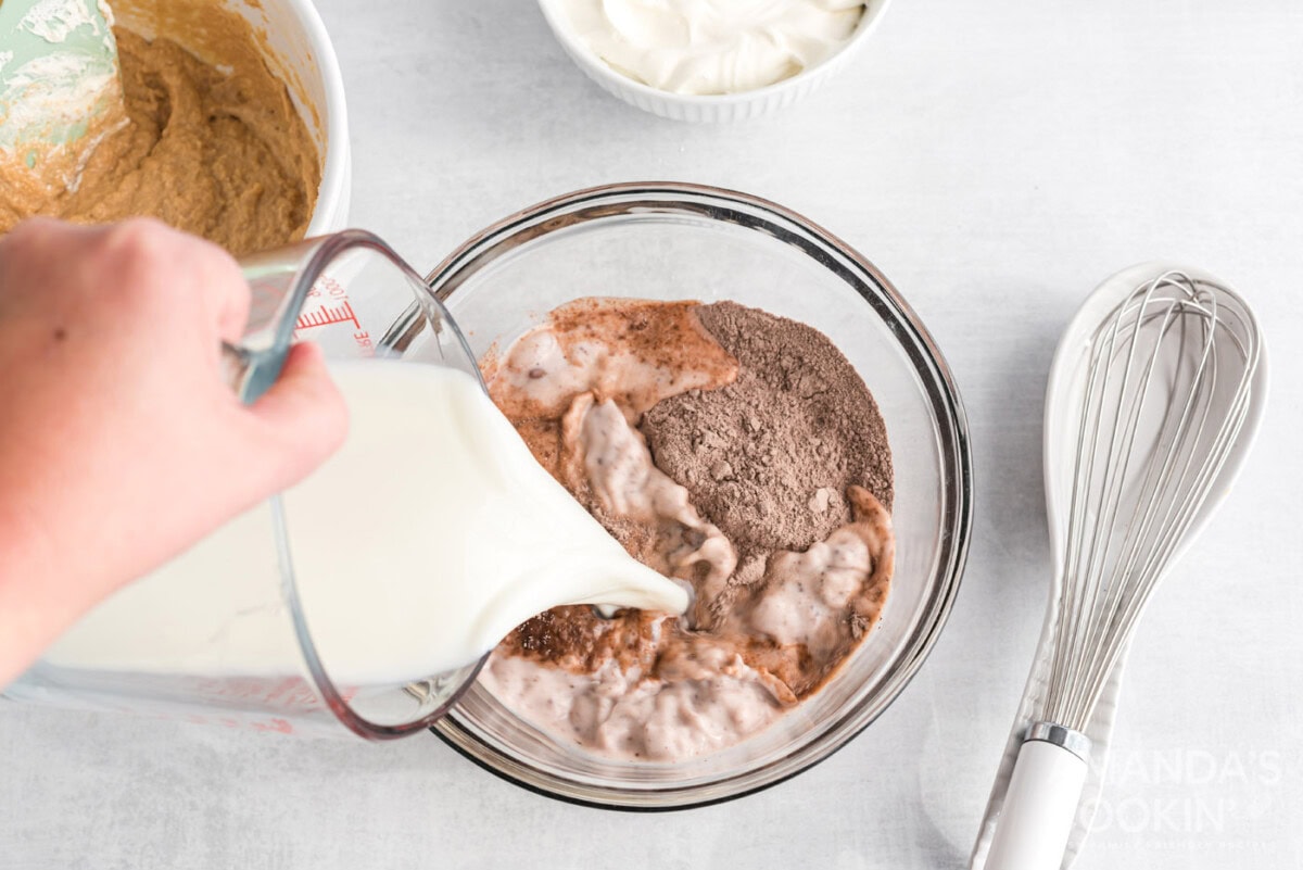 pouring milk into instant pudding