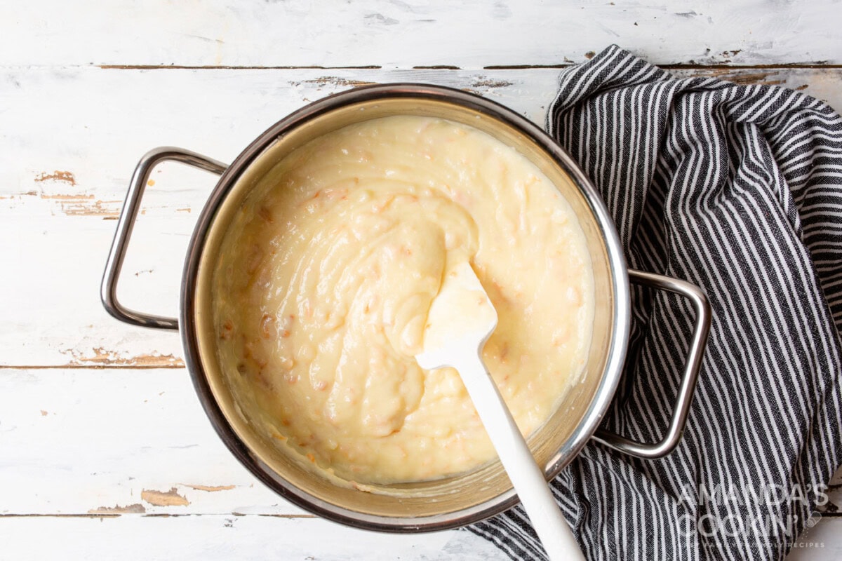 rubber spatula stirring coconut custard