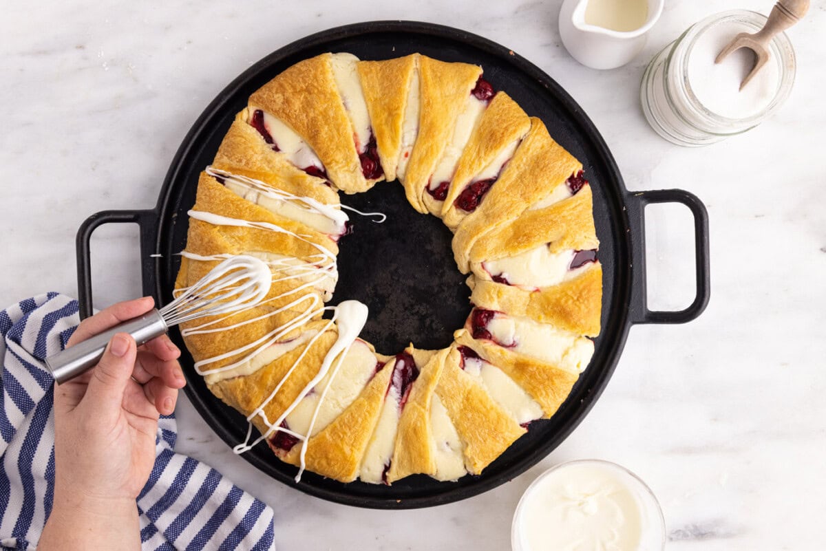 baked crescent danish wreath with icing drizzle