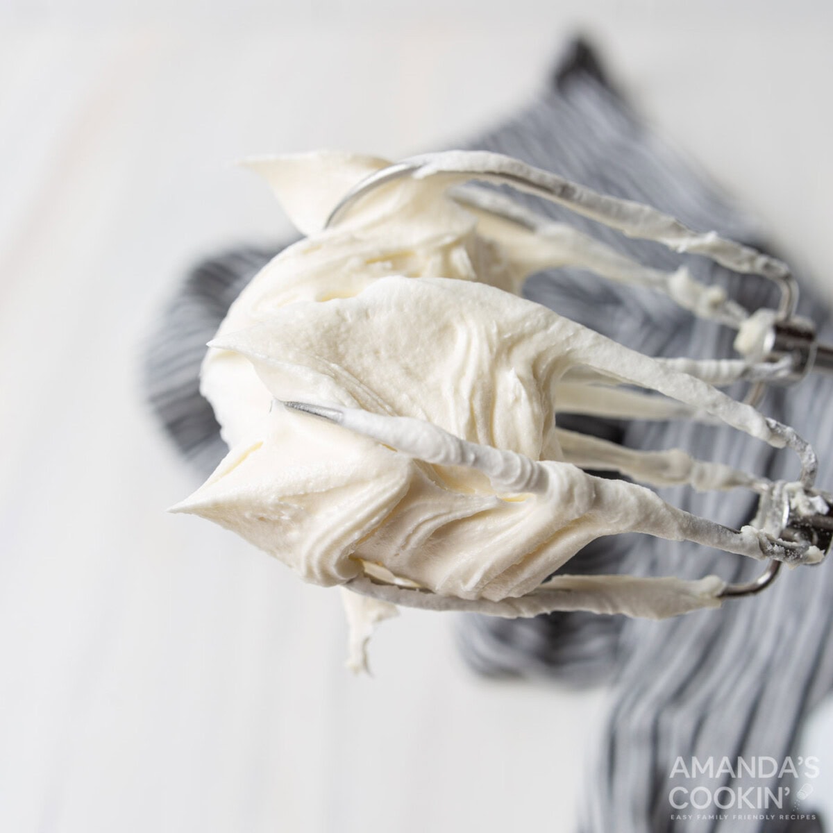 cream cheese frosting on a whisk