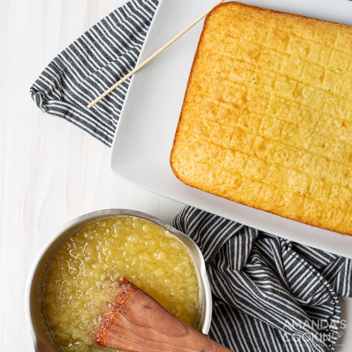 hand in pineapple mixture next to cake