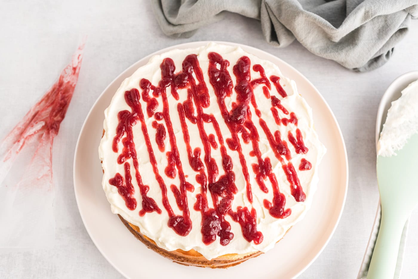 raspberry preserve drizzle on top of English trifle cheesecake