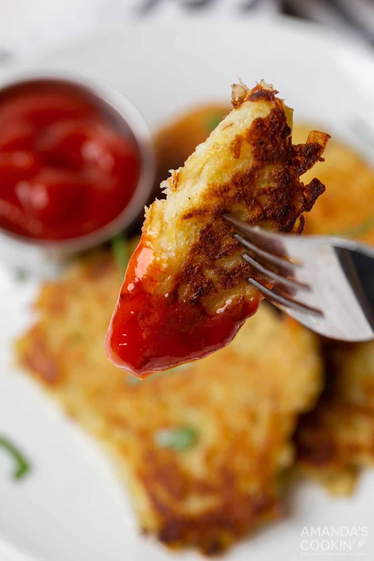 Potato Pancake dipped in ketchup