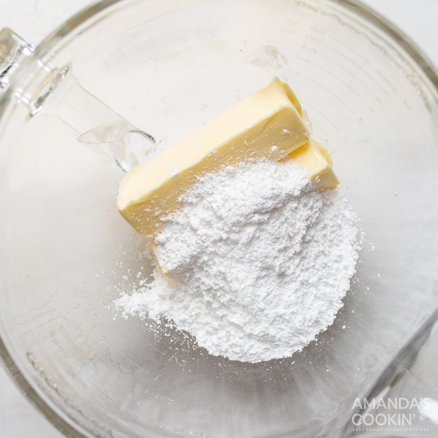 Sugar and butter in a mixing bowl