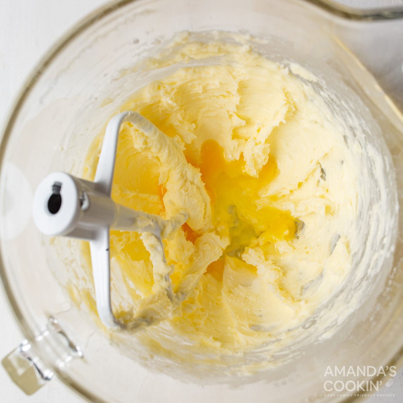 creamed butter and sugar mixture in a bowl with paddle attachment