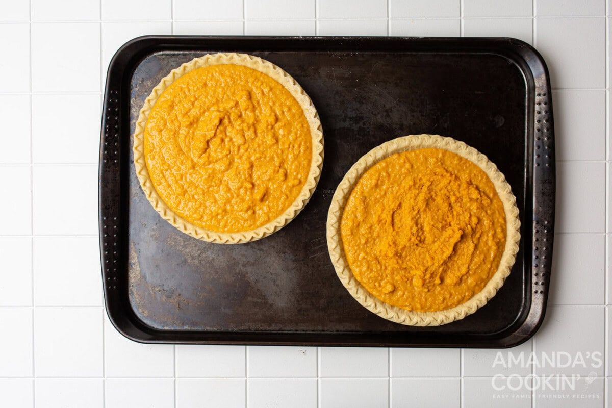 sweet potato pies on a baking sheet