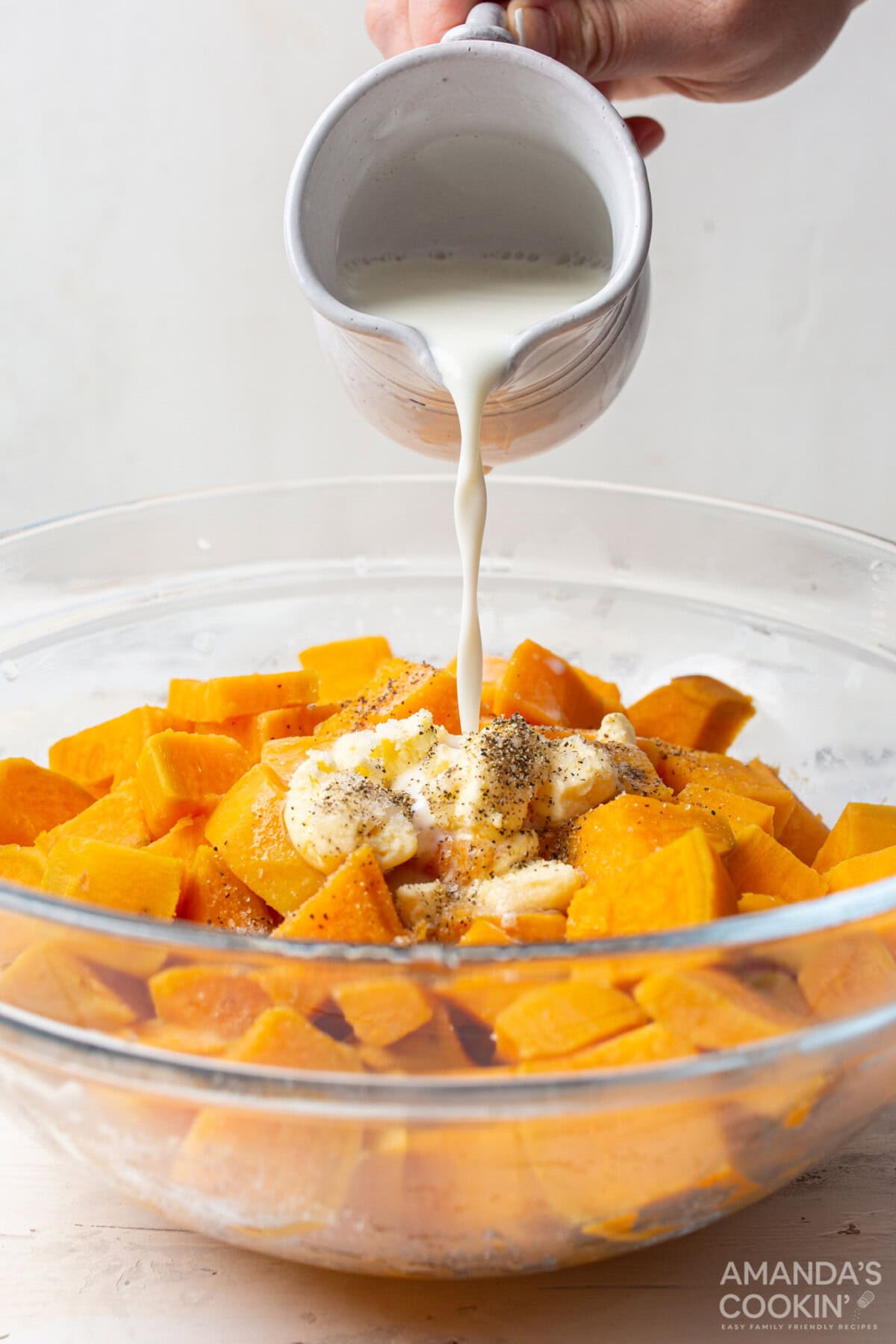 pouring milk over butter and sweet potatoes