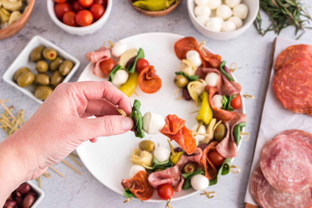 basil, mozzarella ball, and prosciutto on a skewer