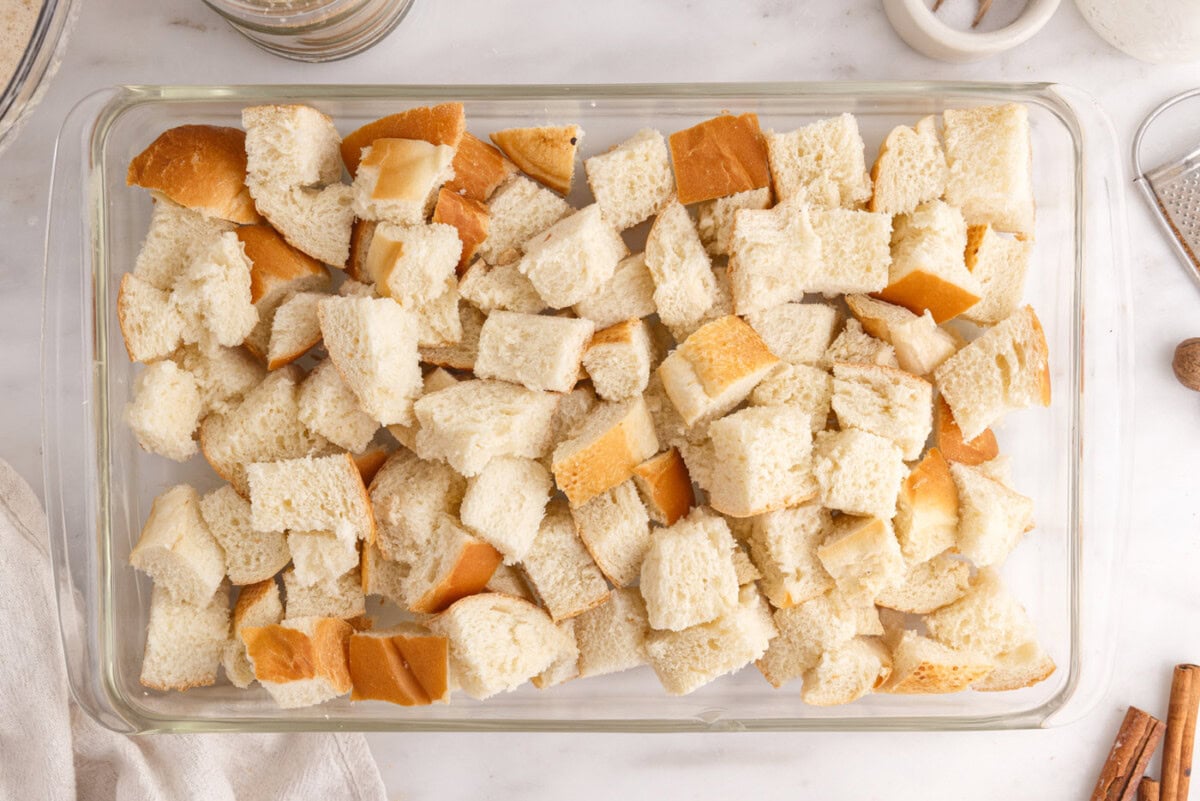 cubed bread in a baking dish