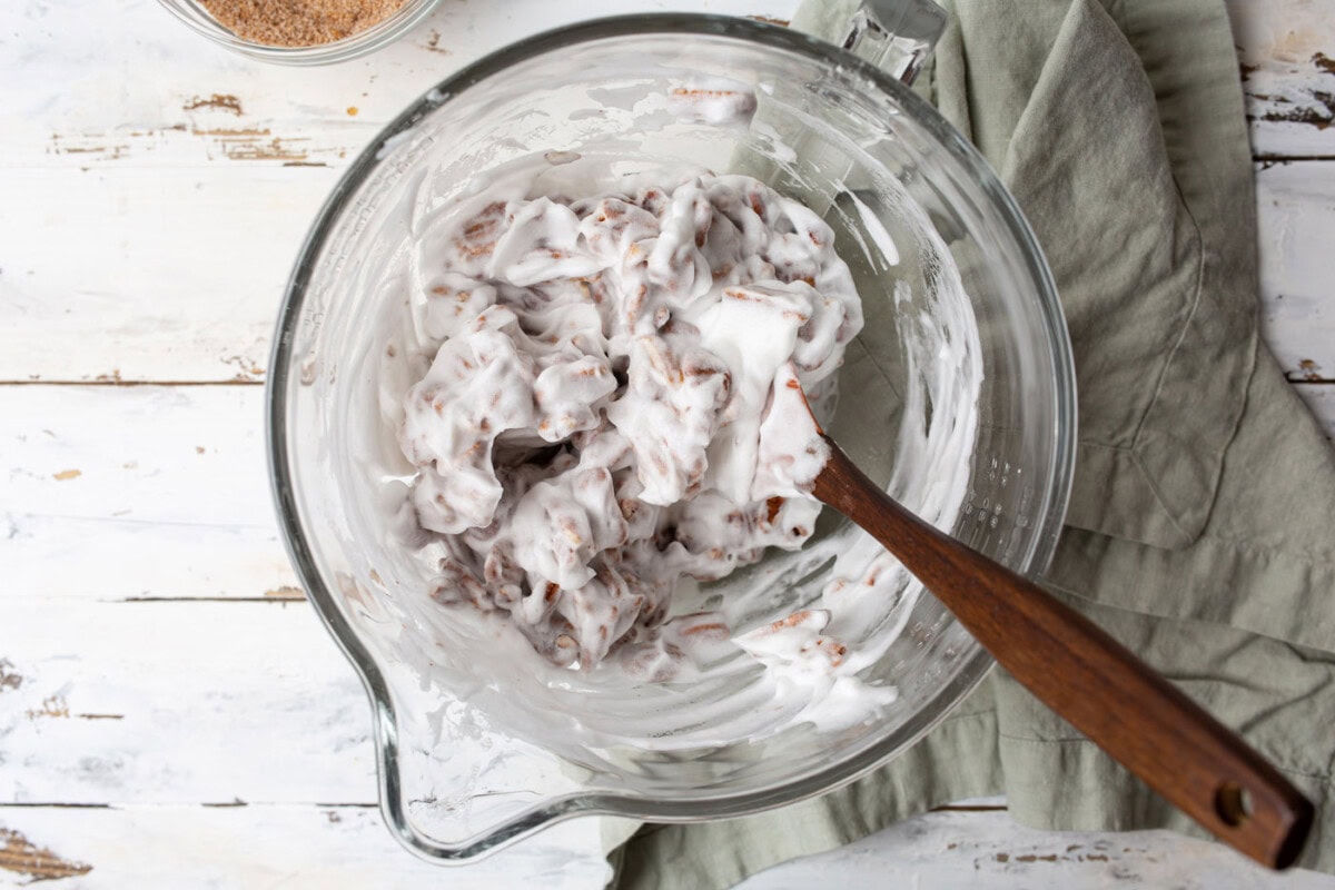 tossing pecans in egg white mixture