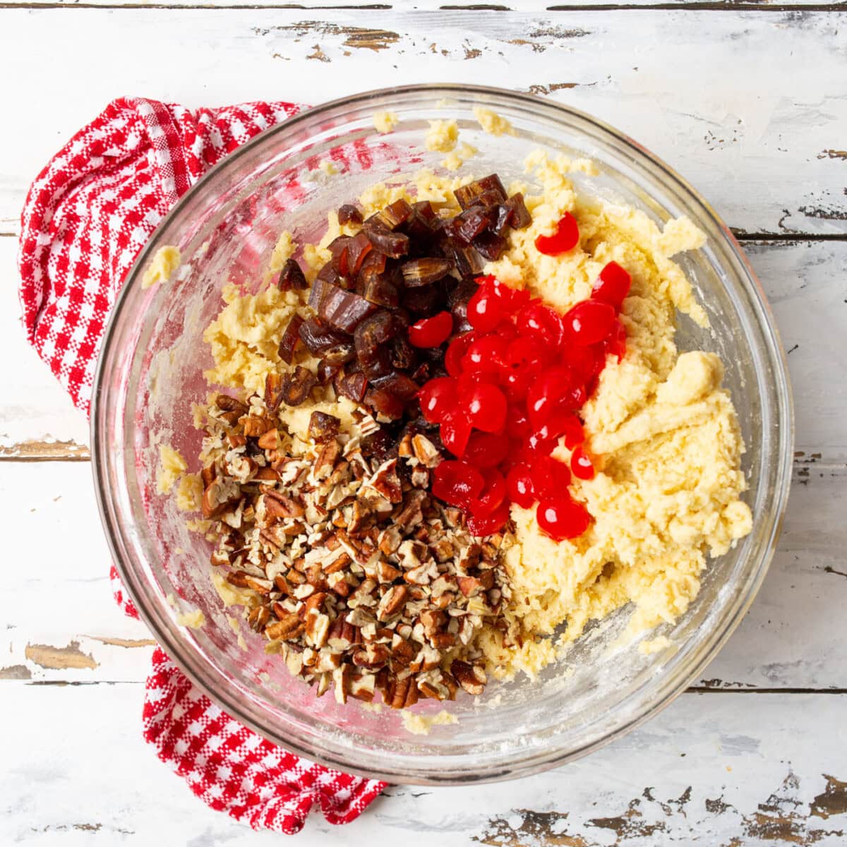 chopped pecans, dates, and maraschino cherries in a cherry wink cookie dough
