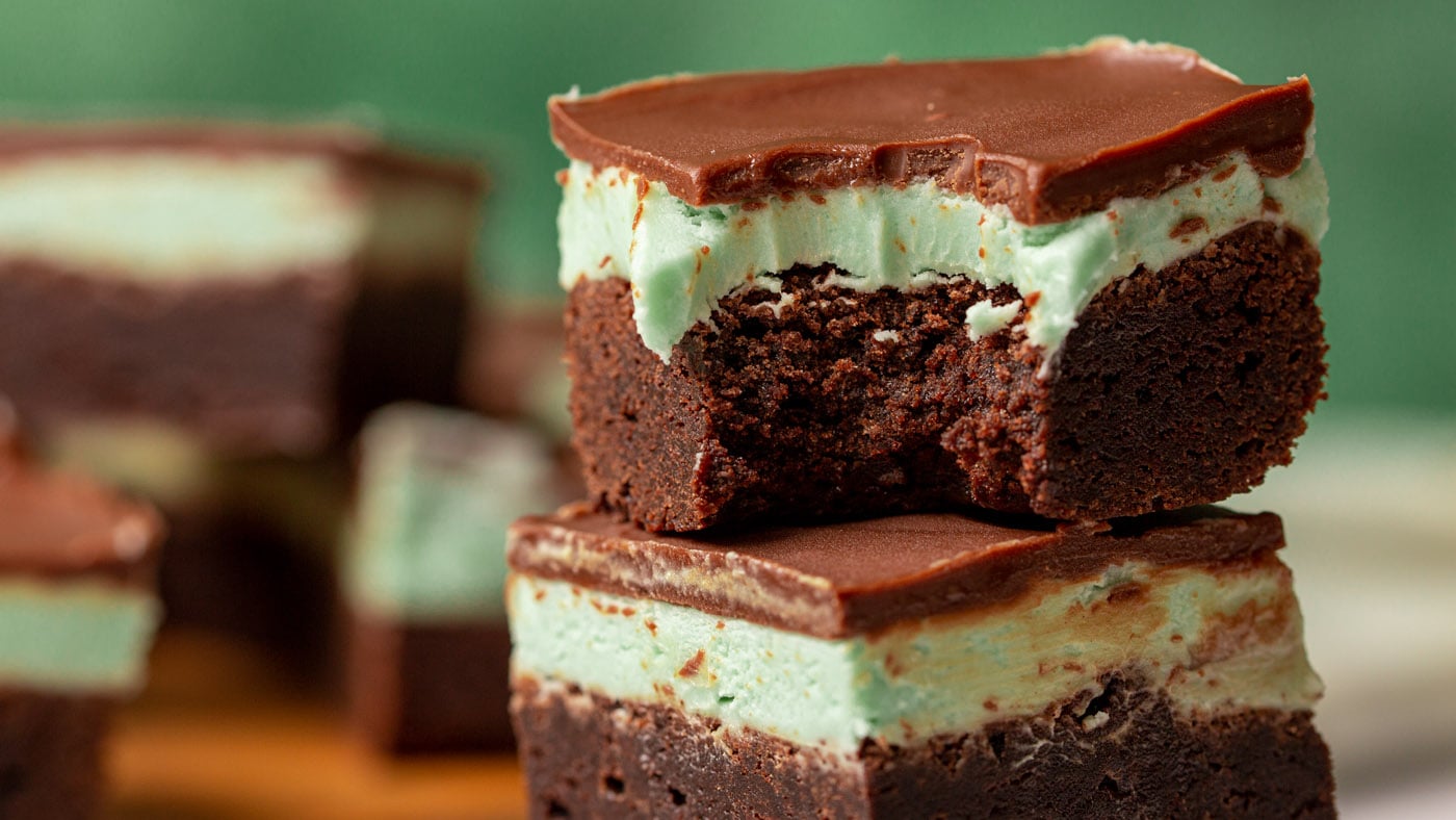 Rich and decadent chocolate mint brownies are stacked with 3 layers of mint chocolate goodness and a