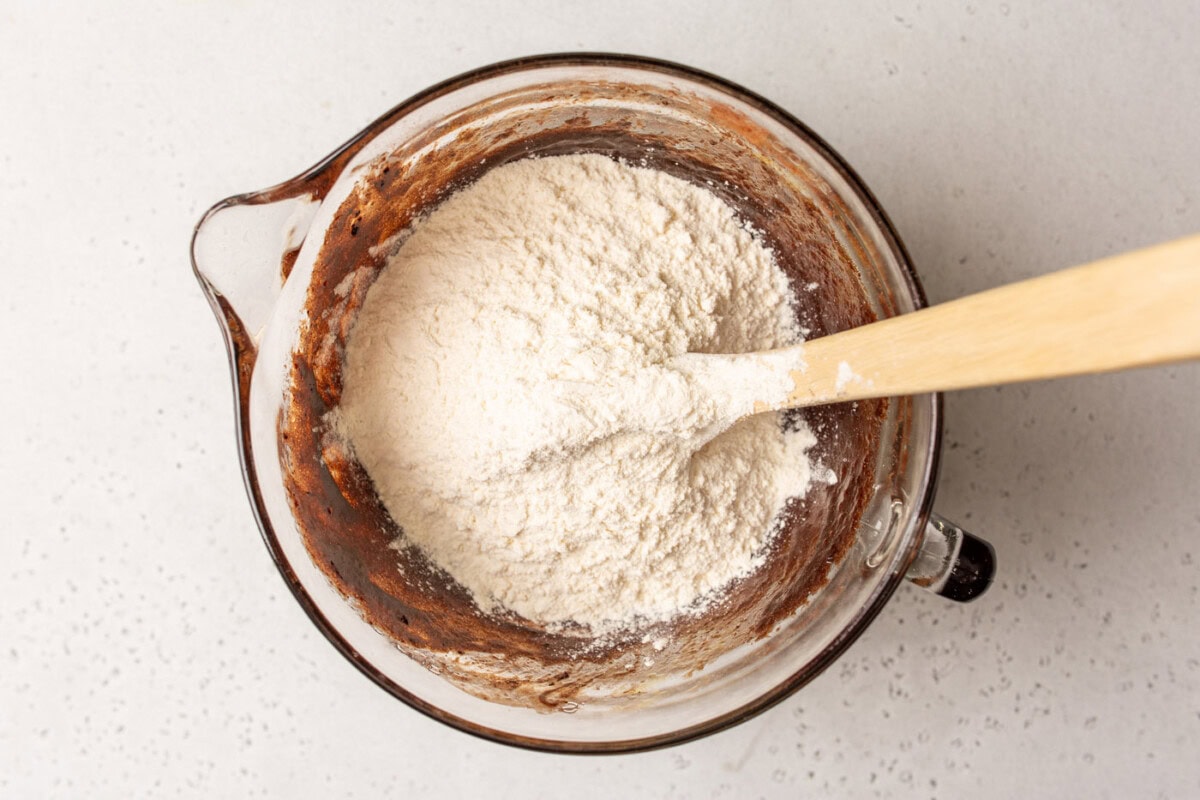 bowl of chocolate brownie batter with flour