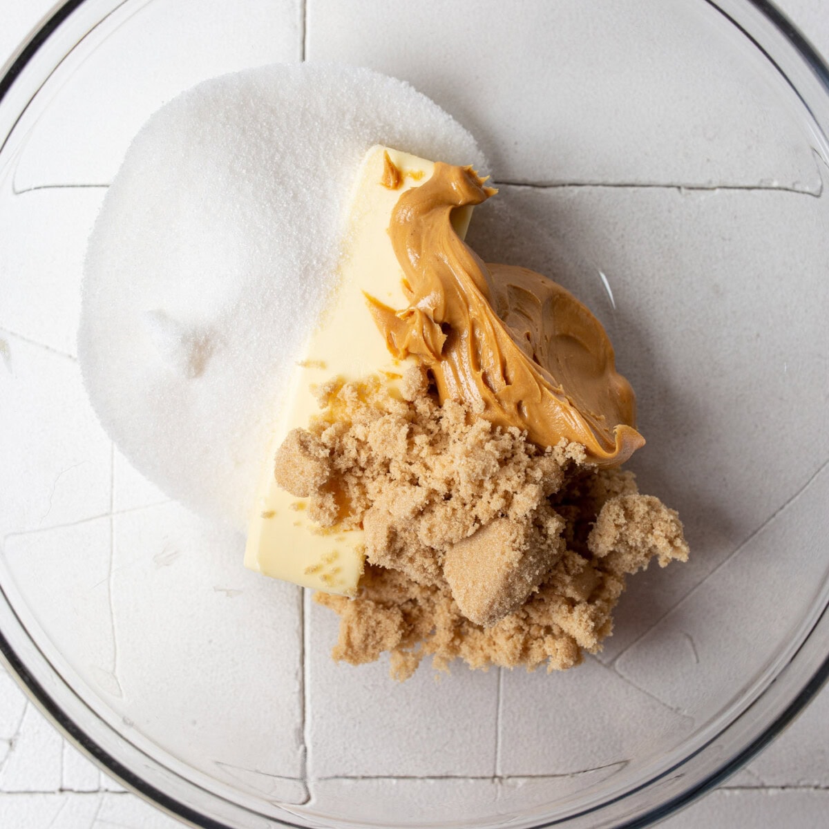 peanut butter, brown sugar, and sugar in a bowl