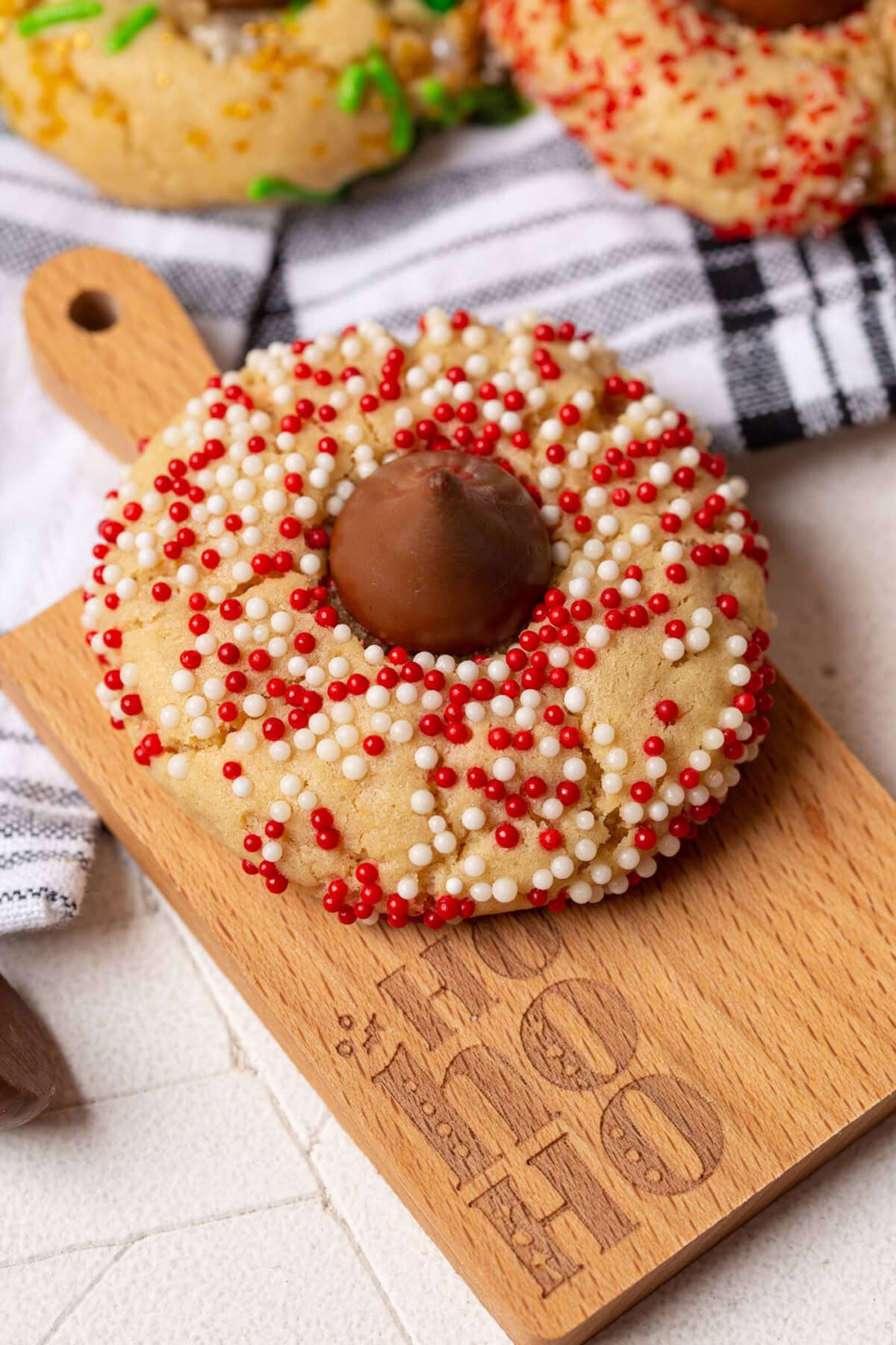 Christmas Kiss Cookies on cutting board