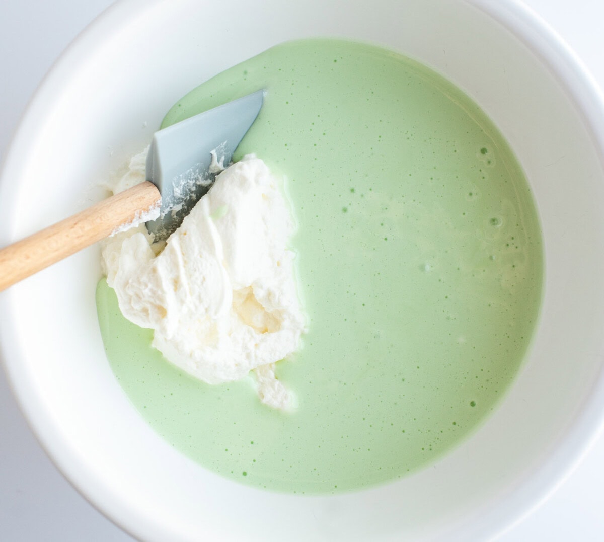 green food coloring and pepper mint extract mixed with marshmallow mixture