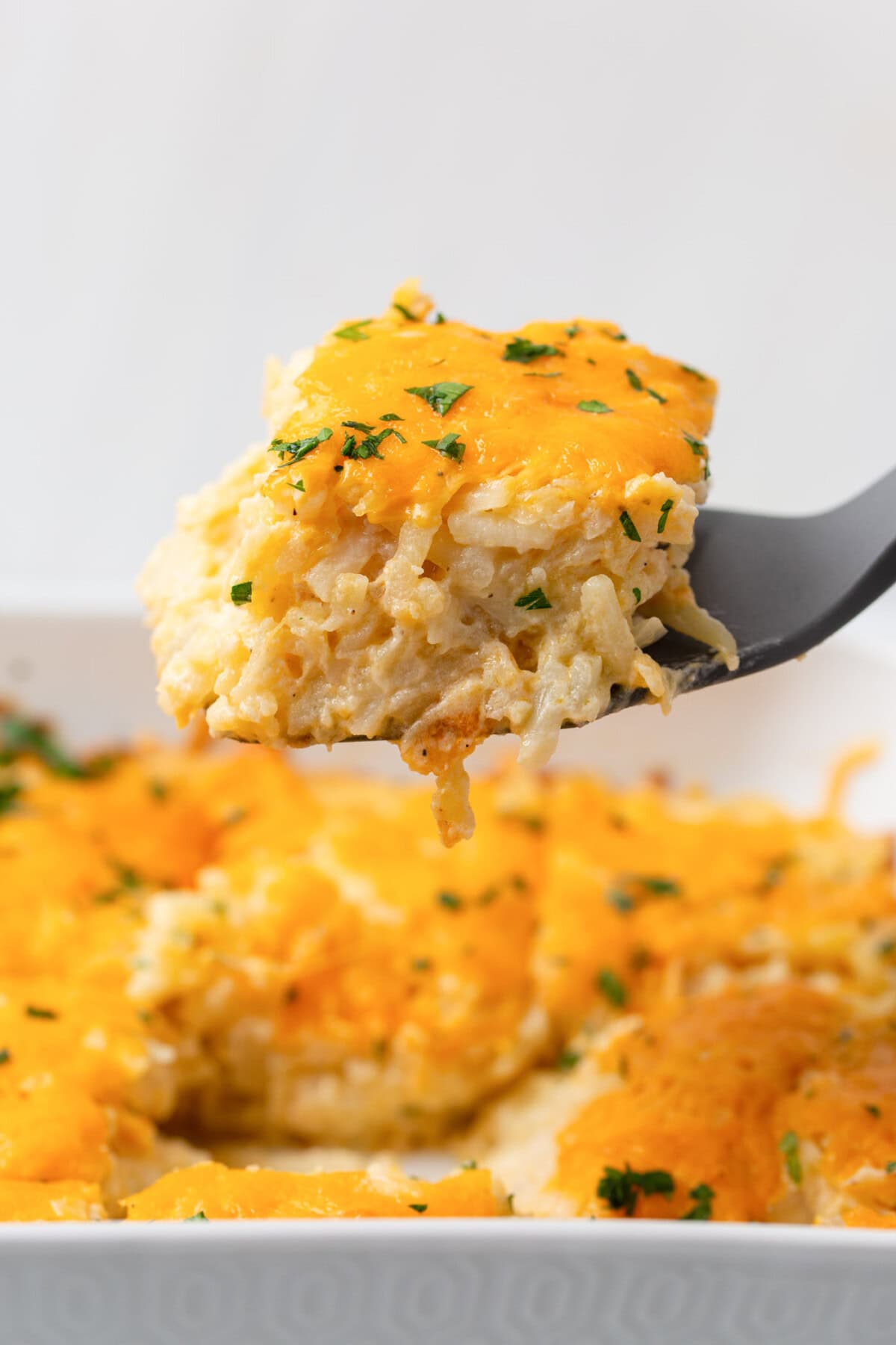 spatula lifting Hashbrown Casserole