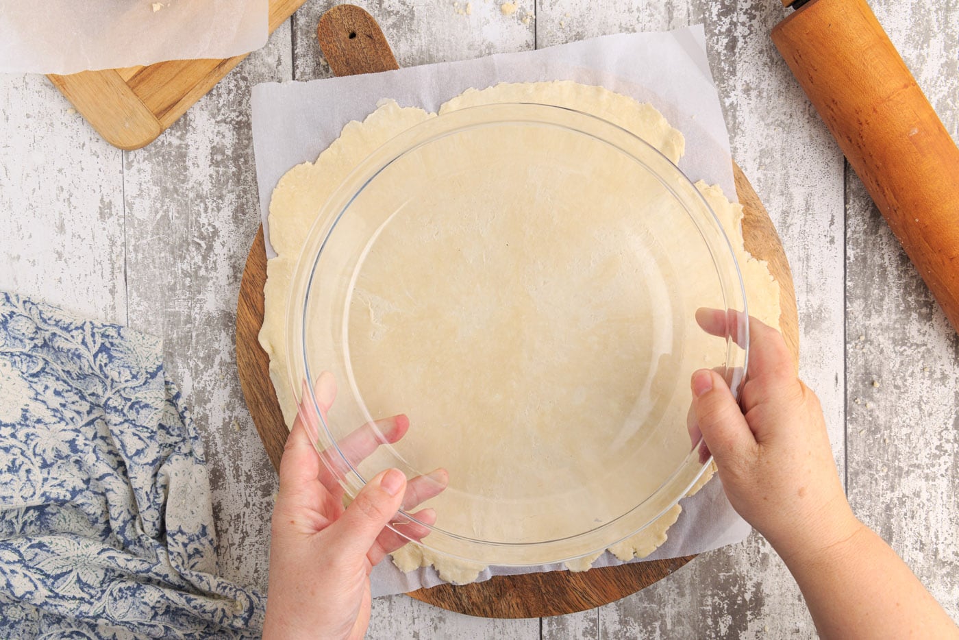 pie plate on top of pie dough