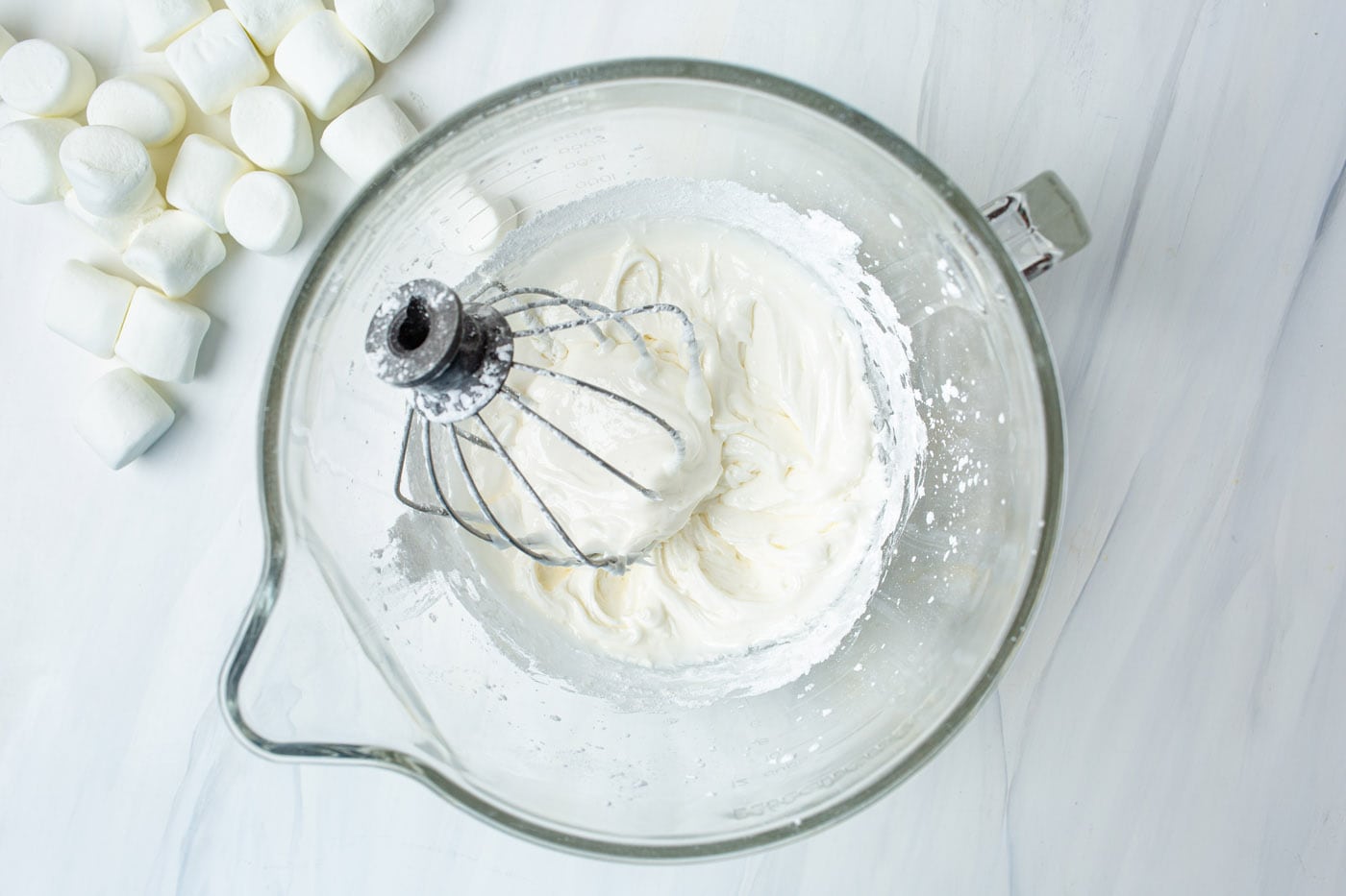 egg whites, vanilla, and powdered sugar in a stand mixer bowl