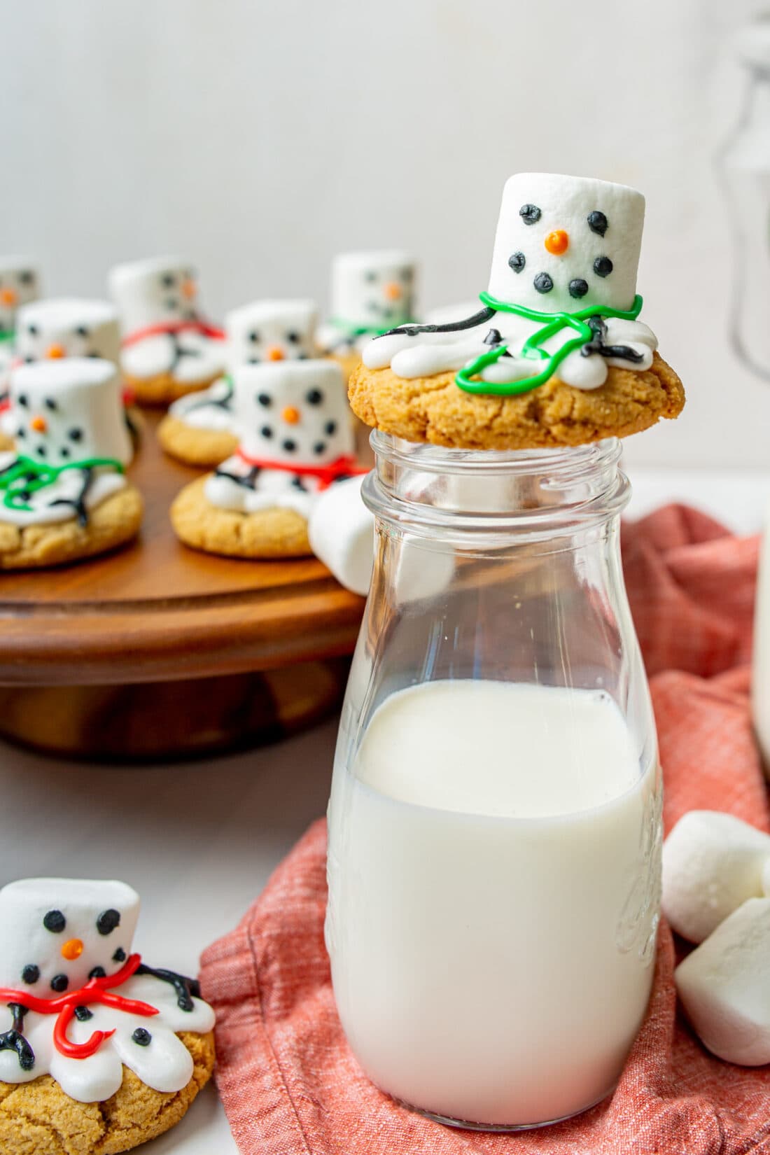 Melted Snowman Cookies on a bottle of milk