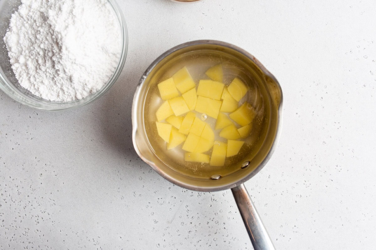 boiling potatoes in a saucepan
