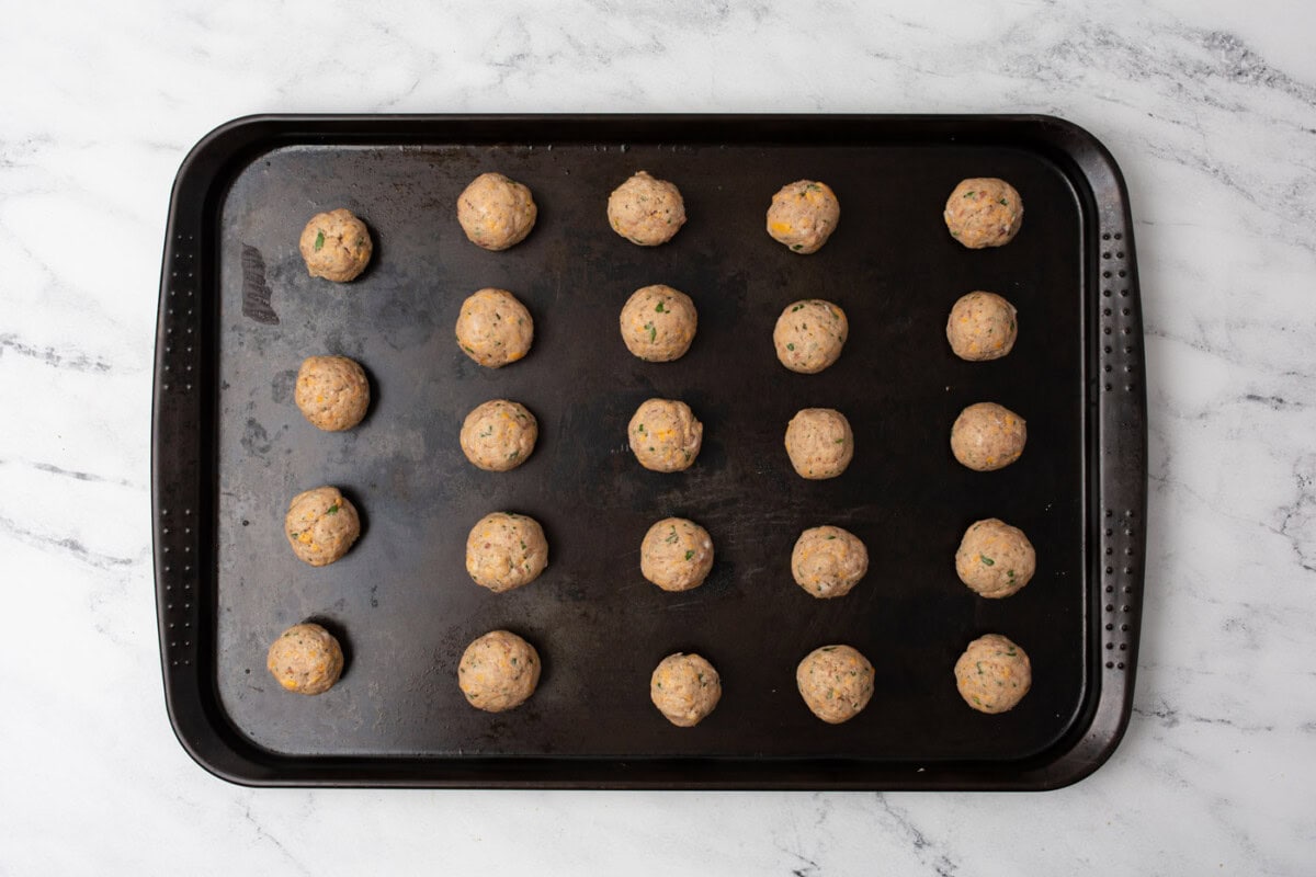 sausage balls on a baking sheet