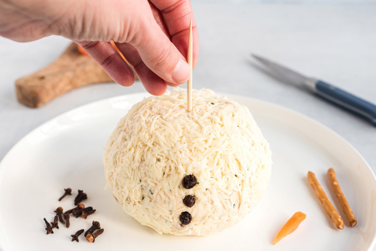 toothpick inserted into cheeseball
