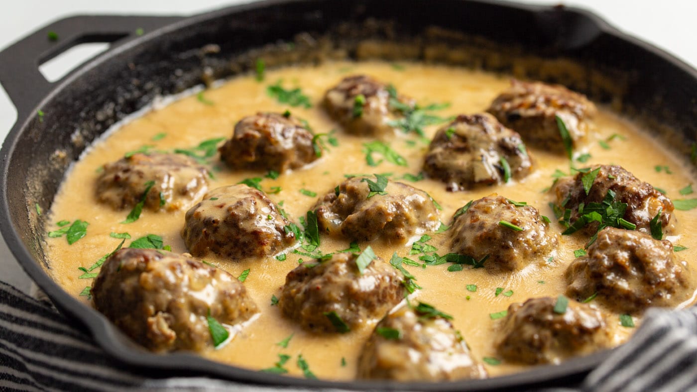 These Swedish meatballs are infused with allspice and nutmeg for subtle warmth then topped with a cr