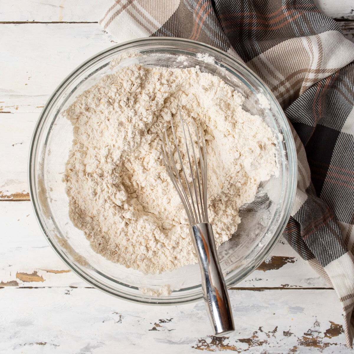 dry ingredients for cookies in a mixing bowl with a whisk